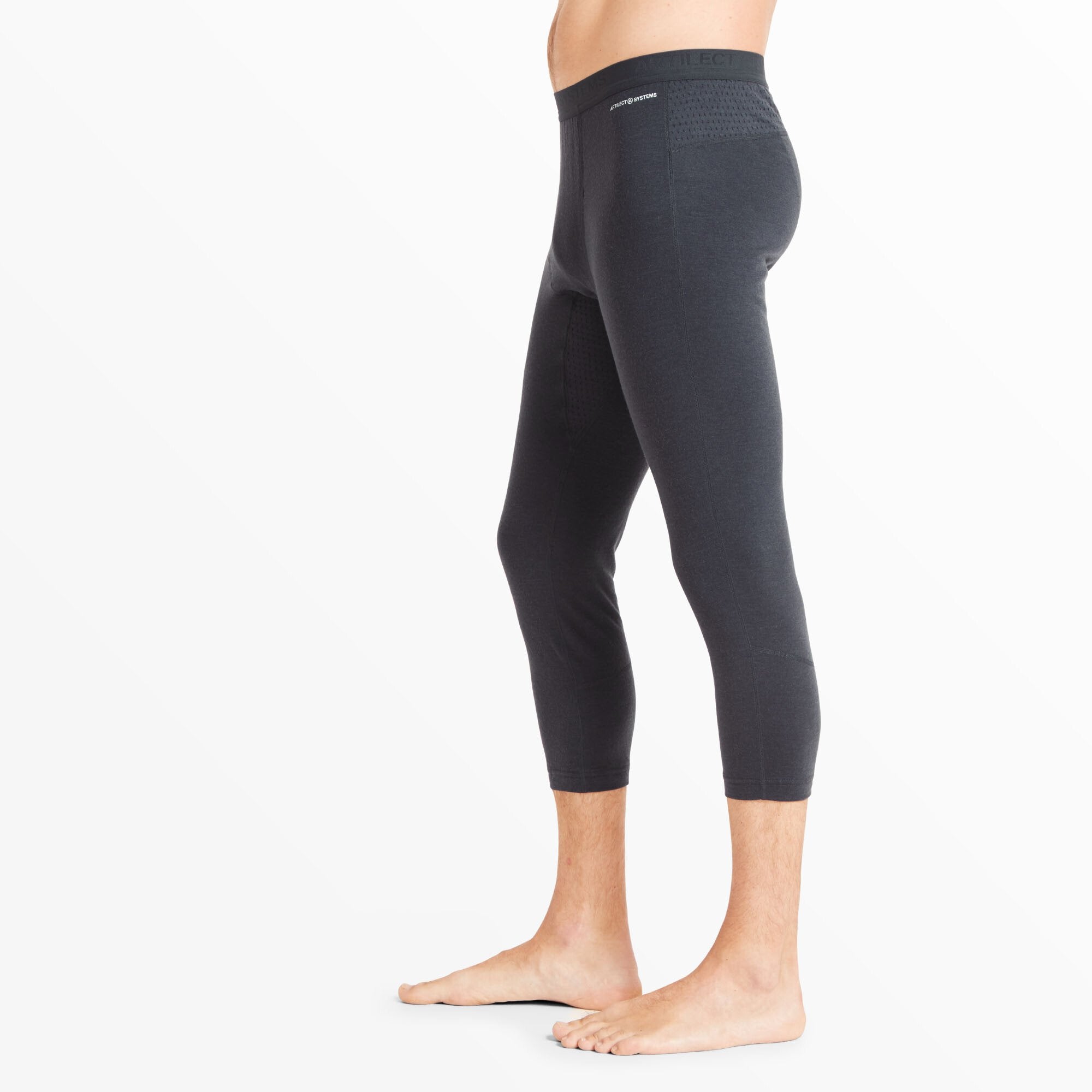 The Artilect Performance Mens Boulder 125 3/4 Legging Blue are shown from a side profile, highlighting their contouring fit along the leg and hip. Small perforations or mesh sections can be seen near the waistband, suggesting ventilation zones for enhanced breathability.