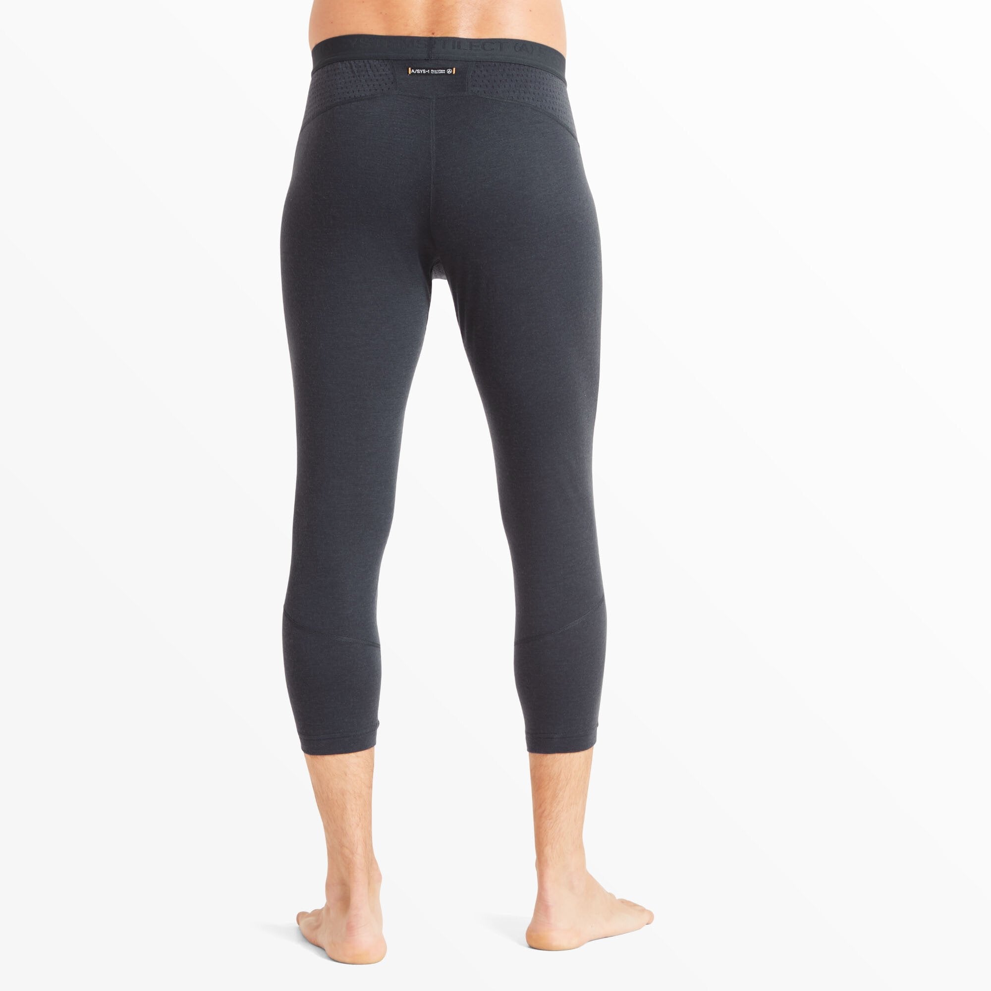 The rear view shows the full back of the Artilect Performance Mens Boulder 125 3/4 Legging Blue, displaying a streamlined fit with a reinforced waistband. A subtle branded label is visible just below the waistband, and the perforated mesh panels continue around the sides for added comfort and airflow.