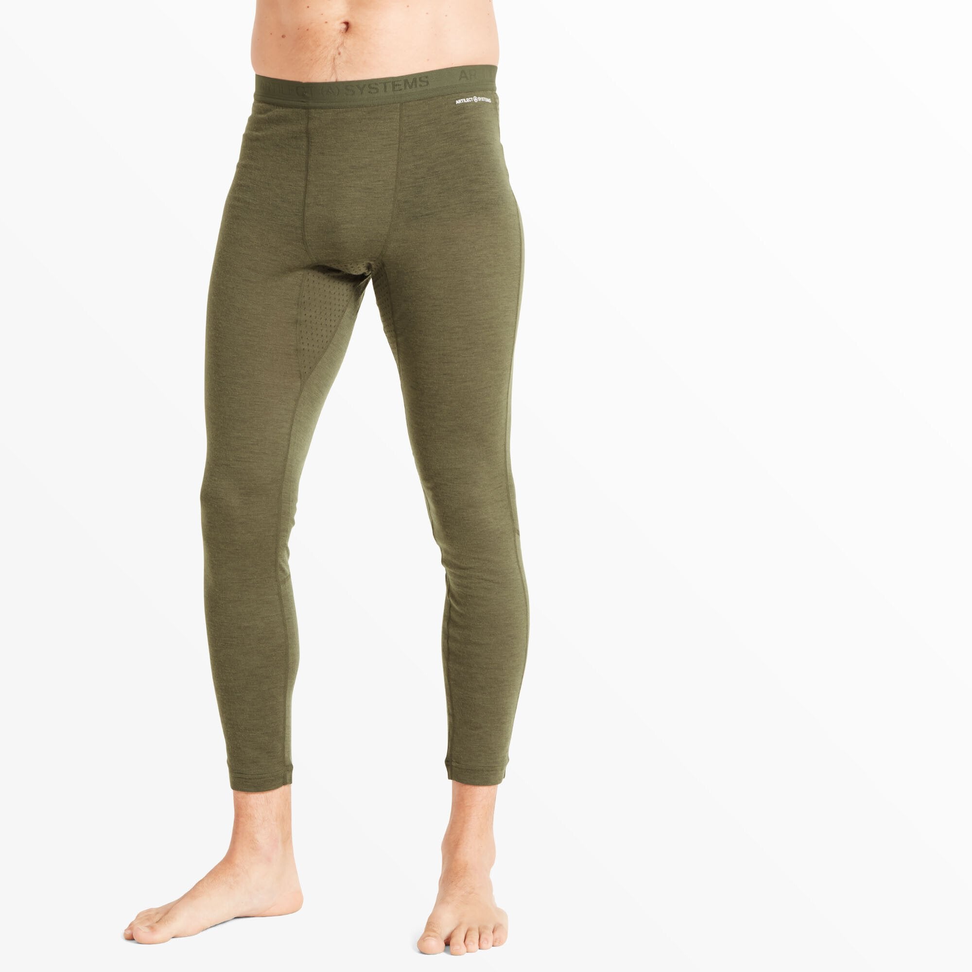 A cropped front-facing image of a male model wearing Artilect Performance Mens Boulder 125 Legging Green. The leggings have a smooth, fitted design with a contoured pouch and minimal seaming. The model is barefoot against a white background.
