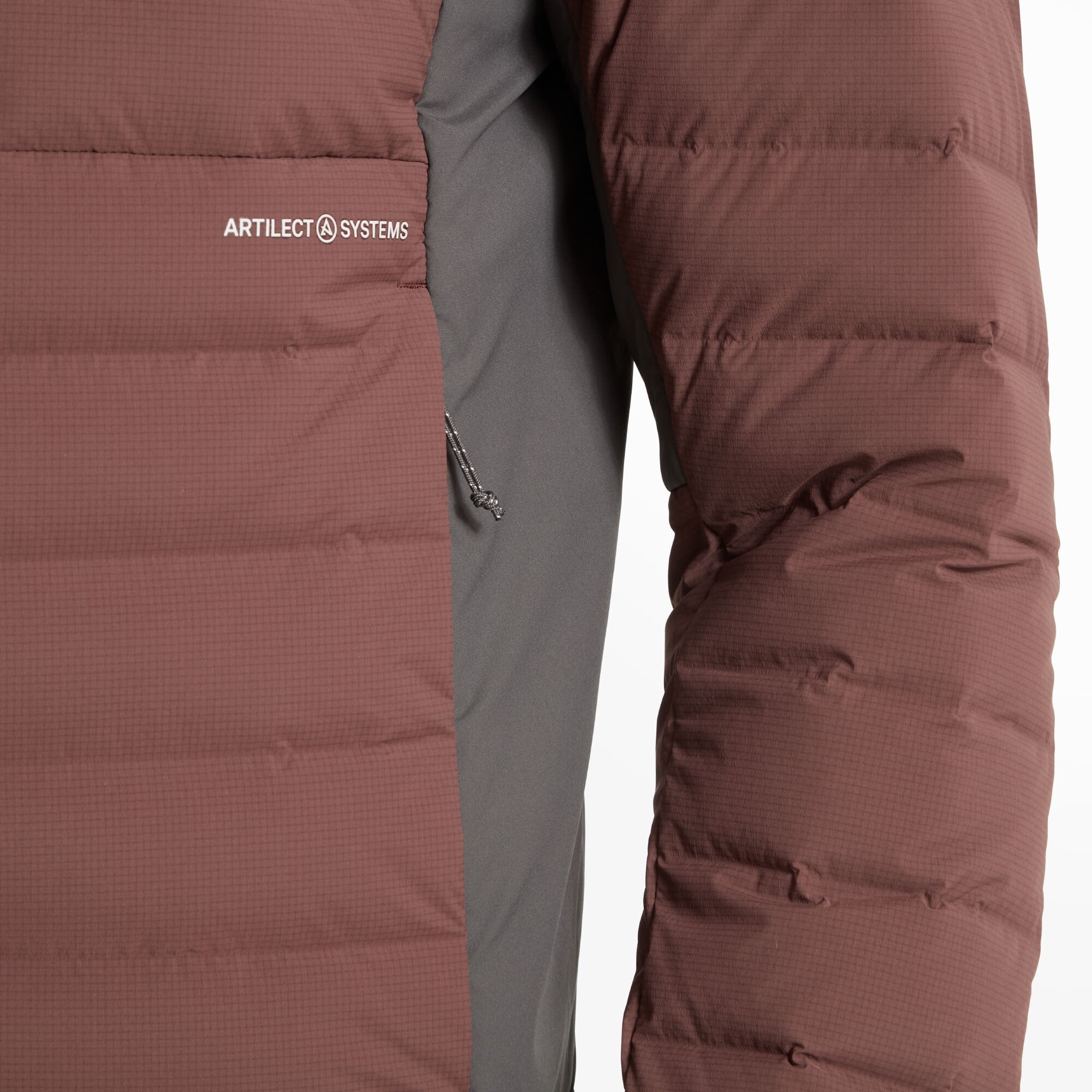 Zoomed-in view of the left side of the Artilect Performance Mens Divide Fusion Stretch Hoodie Burgundy. The Artilect Systems logo is printed on the chest. A zippered hand pocket is visible with a small cord pull, showing the junction between the burgundy and grey fabric panels.