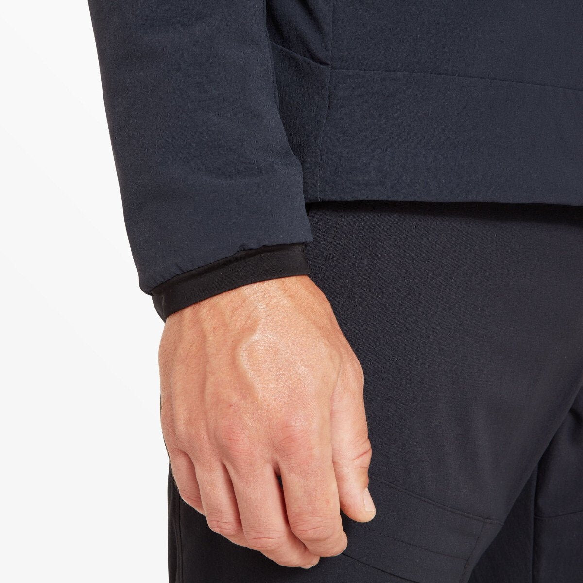 Detailed image of the cuff area. The sleeve is pulled slightly back, revealing a soft, fitted inner cuff layer underneath the outer insulated fabric for wind and warmth protection on the Artilect Performance Mens Elevate Primaloft Bio Insulated Hoodie Blue.