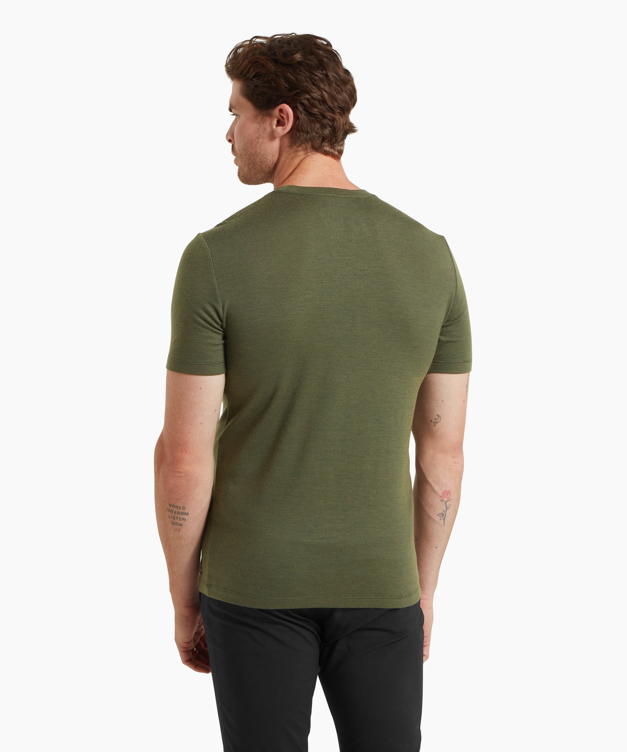 A man wearing a fitted olive-green short-sleeve T-shirt and black trousers, shown from the back against a white background.