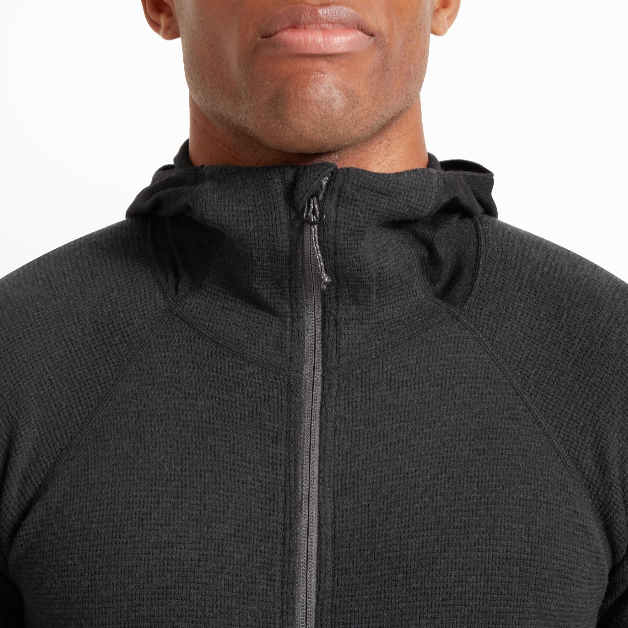 Detailed front close-up showing the upper chest and neckline of the Artilect Performance Mens Sundown 250 Half Zip Top Black. The high collar and zipper construction are clearly visible, with fine stitching and a textured grid pattern in the fabric.