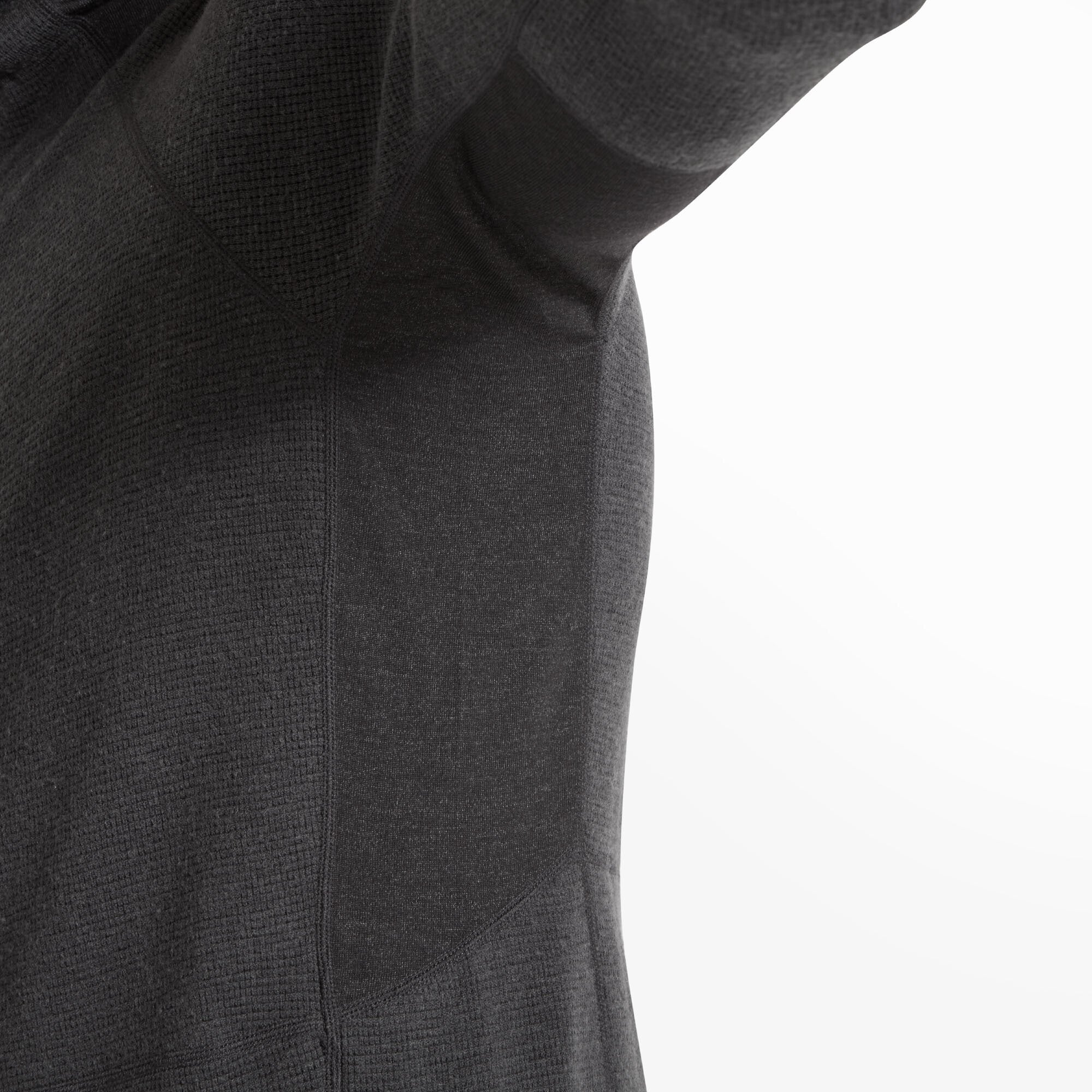 Focus on the underarm and side seam showing the breathable side panel made from a slightly different, more open-knit fabric for ventilation and stretch on the Artilect Performance Mens Sundown 250 Half Zip Top Black.