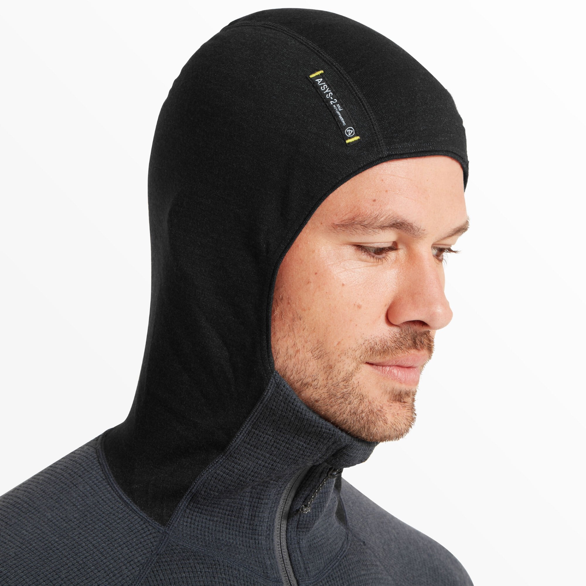 A detailed side view of the hood pulled over the man’s head. The black hood has a smooth fit with a label that reads “ASY-S2” and technical specifications printed near the temple area.