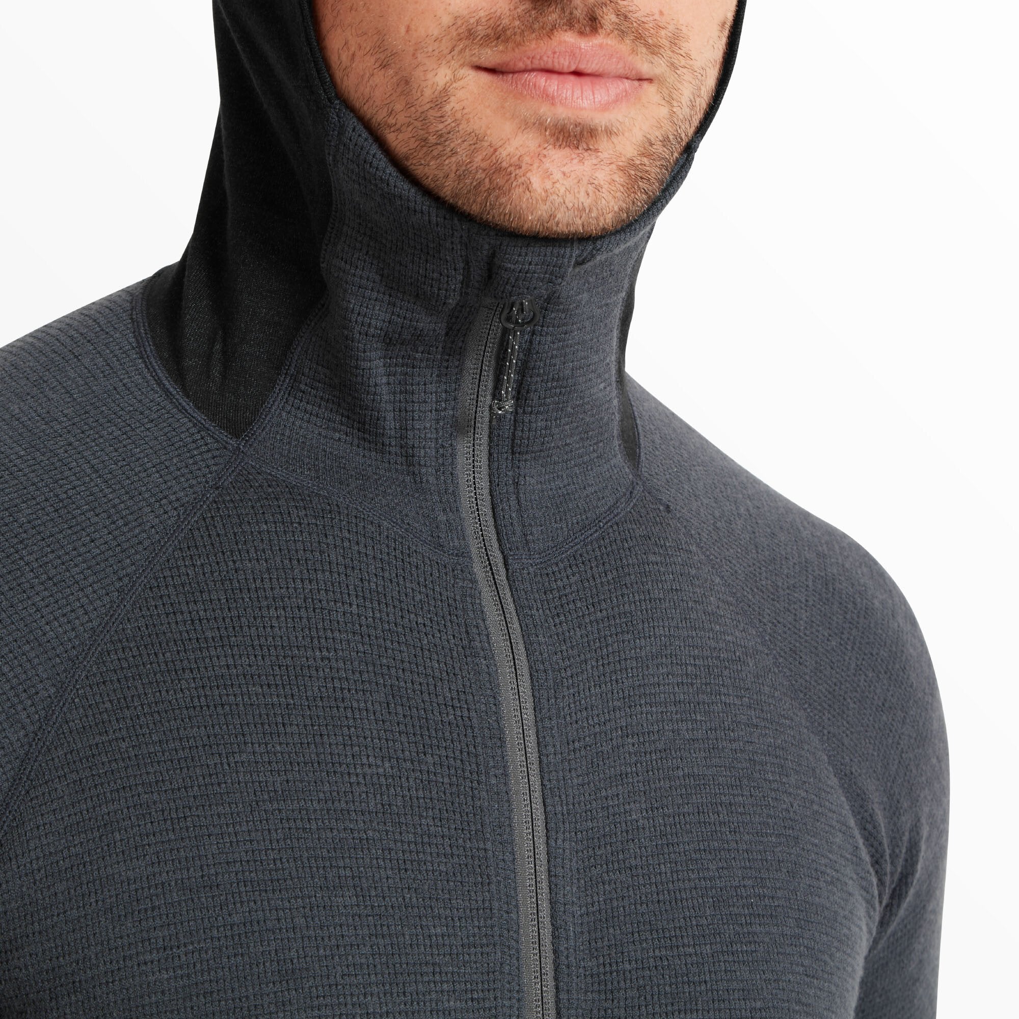 A close-up shot showing the high collar zipped all the way up under the chin. The waffle-texture fabric and central seam running from chest to chin are visible, emphasizing the Artilect Performance Mens Sundown 250 Half Zip Top Blue’s form-fitting design.