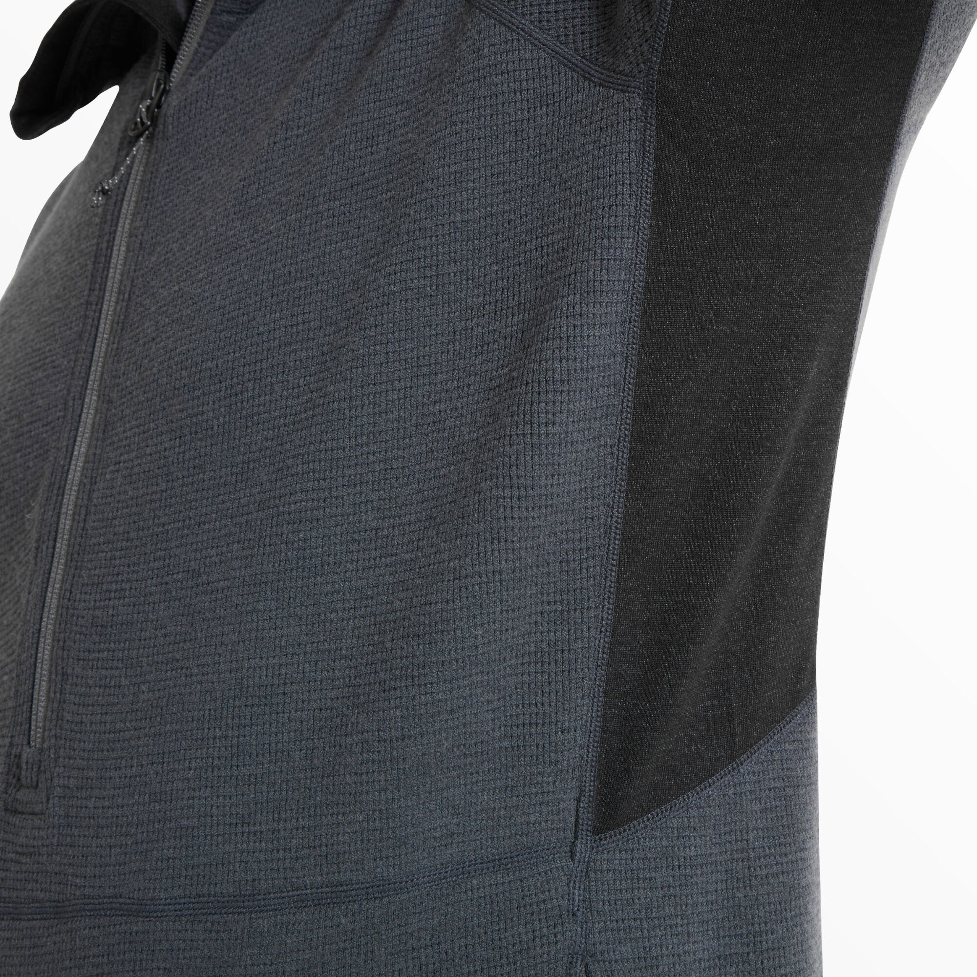 This shot zooms in on the underarm and side torso area to highlight the contrast panel design and the breathable waffle-knit fabric that promotes ventilation on the Artilect Performance Mens Sundown 250 Half Zip Top Blue.
