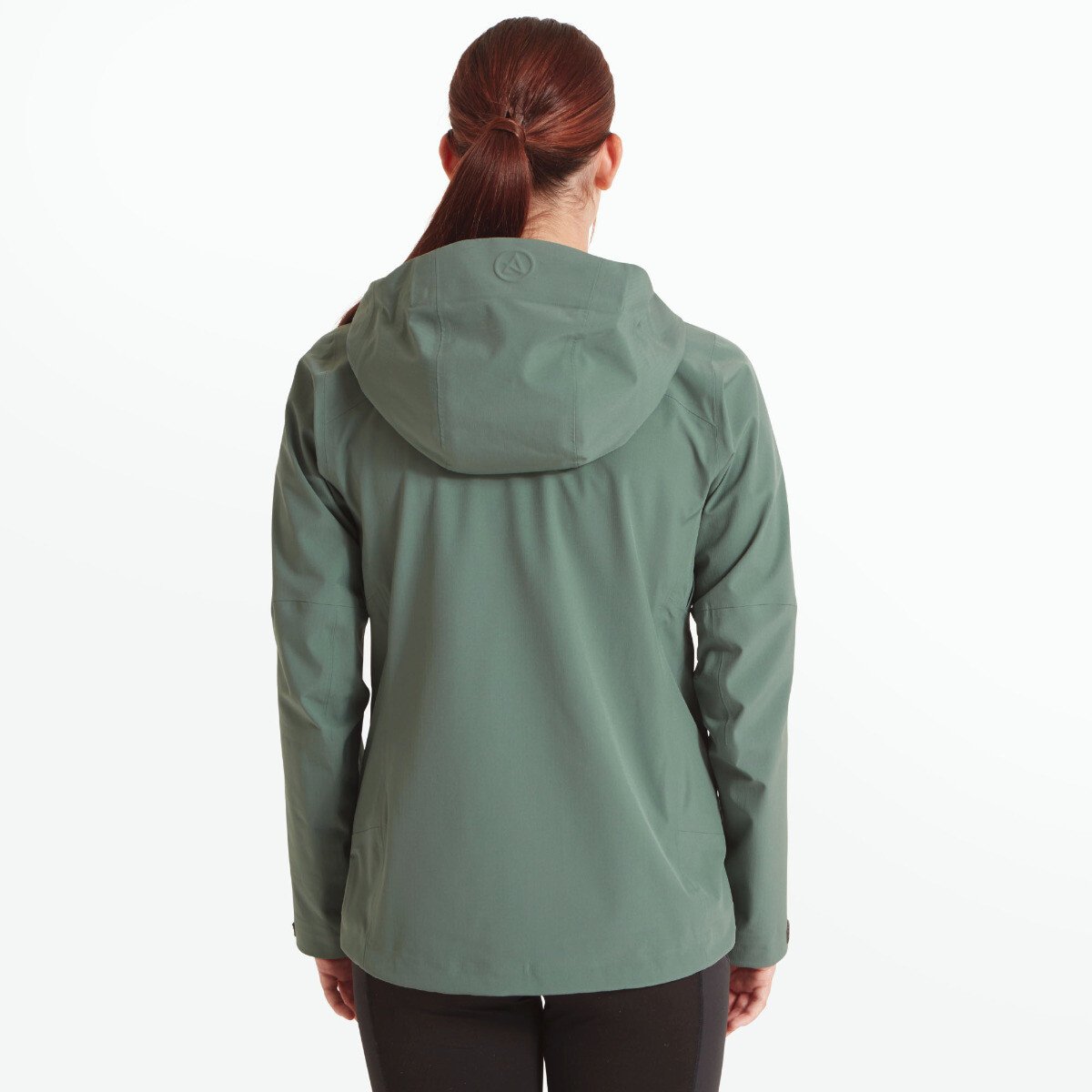 A rear view of the Artilect Performance Womens Grandview 3L Jacket Green shows a simple and clean design with a well-structured hood. The Artilect logo is subtly embossed at the center top of the hood. The jacket curves slightly at the lower back for a flattering fit.
