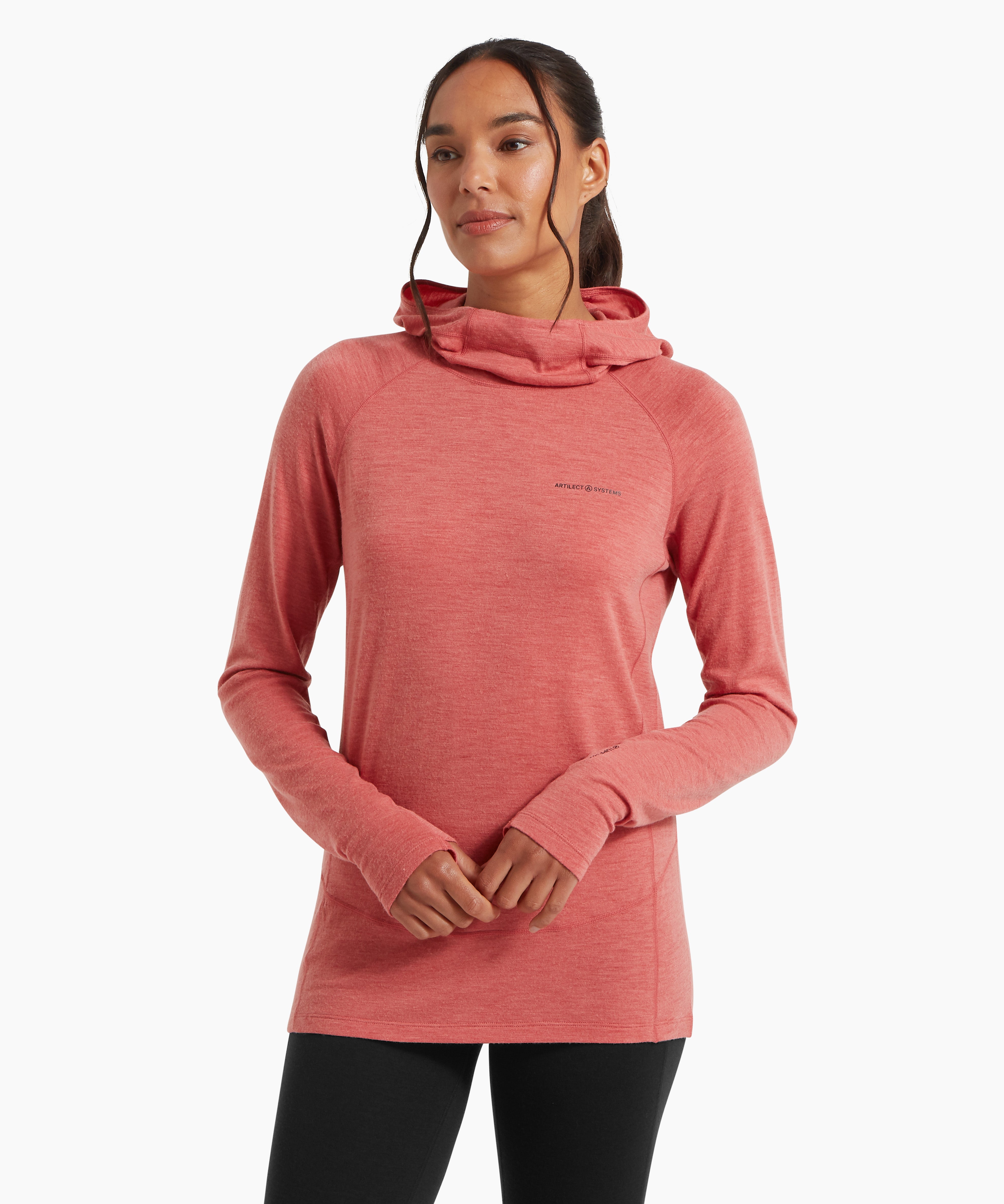 A close-up of a woman wearing a coral‑pink lightweight hooded top, shown with the hood pulled up and one hand holding the collar. The soft, textured fabric is visible.